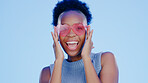 Black woman, happiness in portrait and heart sunglasses, funky accessory with fun isolated on blue background. Shades, protection and eye care with party, fashion and vision with energy in studio