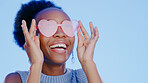 Fashion, sunglasses and smile, black woman in studio with cool, trendy summer style and creative mockup. Happiness, luxury eyewear and excited, fun model with designer frame on blue background space