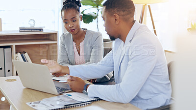 Buy stock photo Black people, laptop and teamwork for business at desk, brainstorming and planning strategy together in office. Computer, collaboration and consultants at table in discussion for research project