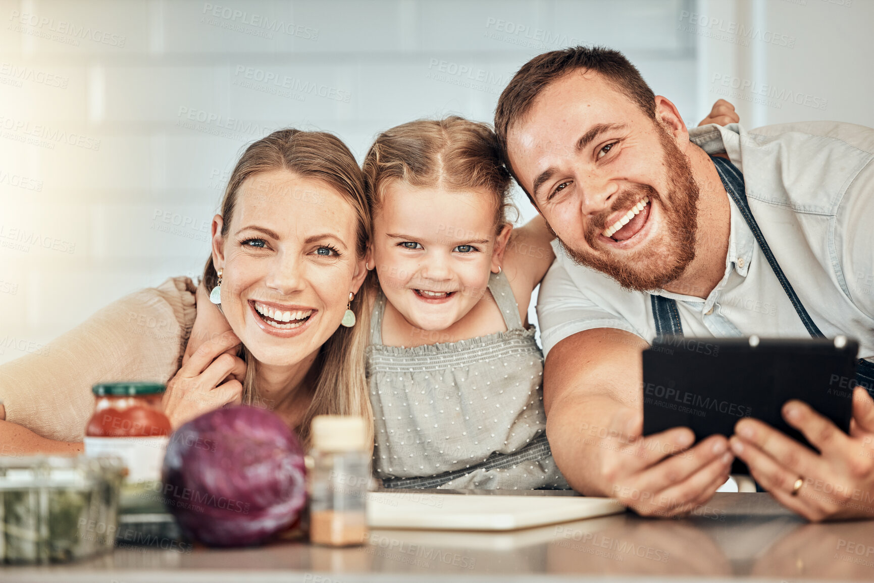 Buy stock photo Happy family, cooking and parents with child in a kitchen to prepare a meal with online recipe in a home together. Bonding, smile and portrait of kid hug mother and father in a house with food