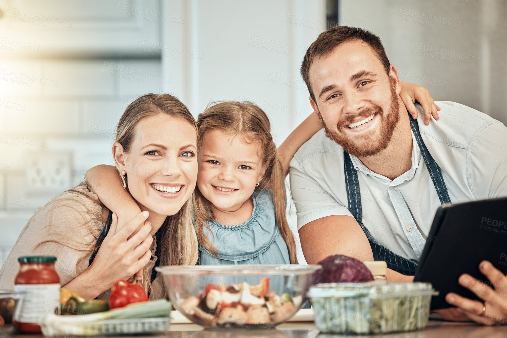 Buy stock photo Portrait of happy family in kitchen, cooking with kid and smile, learning and nutrition with parents smile. Mom, dad and girl child making healthy food in home with care, support and love at lunch.