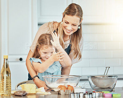 Buy stock photo Mom, girl child and flour in kitchen, development and baking with bonding, love and care in family house. Cooking, mother and daughter with smile, teaching and eggs on table, dust and help for food