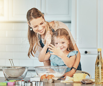 Buy stock photo Mom, girl child and teaching for cooking, development and skills with bonding, love and care in family home. Baking, mother and daughter with smile, flour and eggs on table, kitchen and help for food