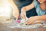 Hands, baking and parent help child with cooking in a home kitchen learning to prepare cookies or biscuits recipe. Development, table and mother teaching kid a food hobby in a house together