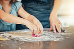 Hands, baking and parent help kid with cooking in a home kitchen learning to prepare cookies or biscuits recipe. Development, table and mother teaching child a food hobby in a house together