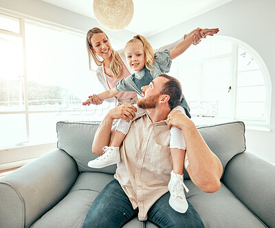 Buy stock photo Parents, child and airplane on sofa, smile or portrait for love, care or bonding in living room at family house. Father, mother and daughter for plane game, excited and relax on lounge couch in home