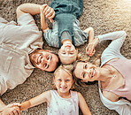 Happy, portrait and children with parents in living room bonding and relaxing together at home. Happiness, love and girl kids laying with mother and father from Australia on floor in lounge at house.