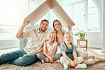 Happy family, portrait and cardboard roof for real estate, moving in or property investment at new home. Mother, father and kids smile for shelter, apartment or relocation together on house mortgage