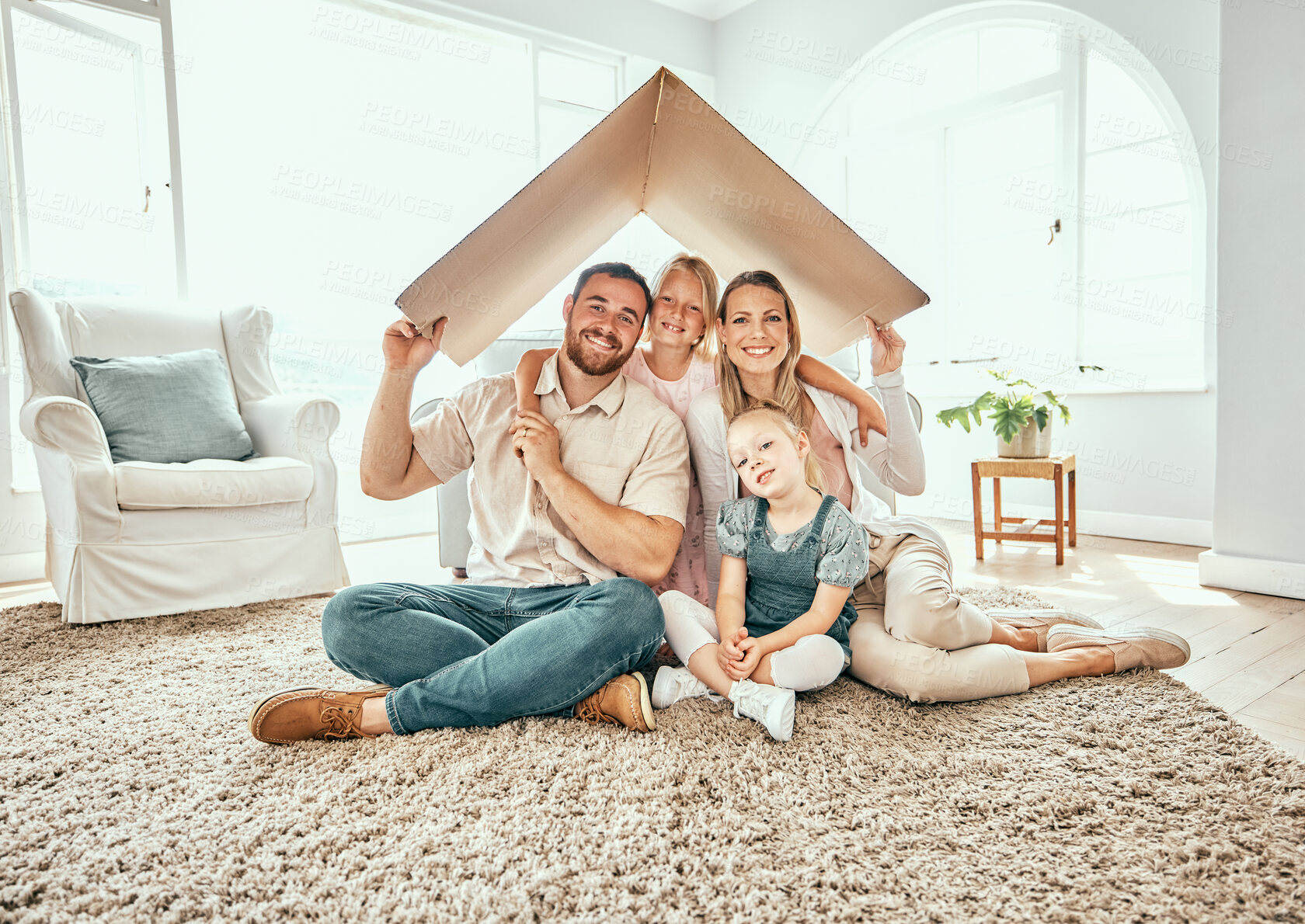 Buy stock photo Happy family, portrait and cardboard roof for moving in, property investment or real estate at new home. Mother, father and kids smile for shelter, apartment or relocation together on house mortgage