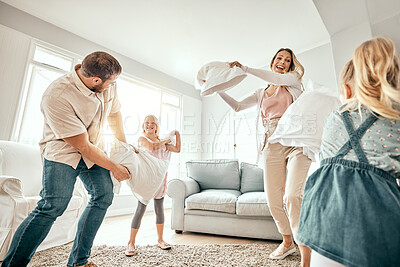 Buy stock photo Happy family, pillow fight and playing in living room for bonding, fun holiday or weekend together at home. Mother, father and children smile with cushion game, play or free time for summer break