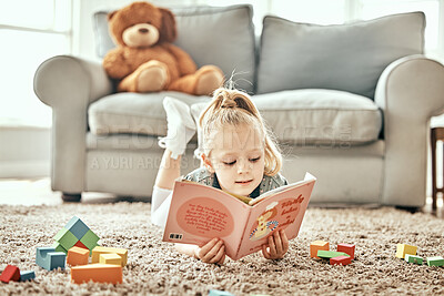 Buy stock photo Learning, floor and child reading a book for education, fiction or studying in a home living room. Relax, carpet and a young girl kid with a story or fairytale in a house for playing, fun and curious