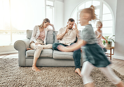 Buy stock photo Family, adhd children and parents headache, stress and anxiety for autism management, energy fatigue or home noise. Tired mother and father on sofa with chaos and hyper or fast, excited kids running