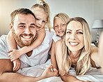 Selfie, smile and portrait of family on the bed for bonding and relaxing together at modern home. Happy, love and girl children laying and taking a picture with parents from Australia in bedroom.