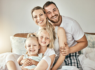 Buy stock photo Happy, love and portrait of family on the bed for bonding and relaxing together at modern home. Happiness, smile and girl children sitting with mother and father from Australia in bedroom at house.