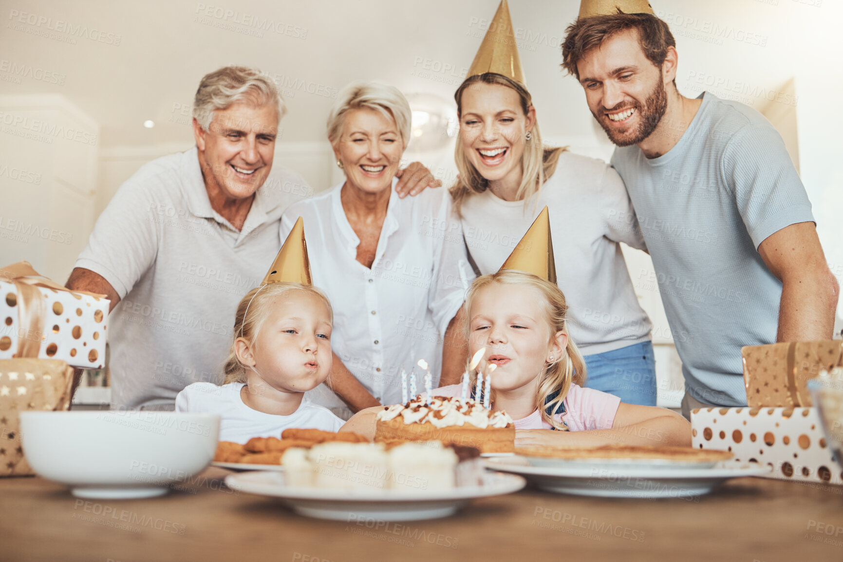 Buy stock photo Parents, grandparents and children with candles on birthday cake for celebration with family, love and sweets in home. Happiness, men and women together at table at girl kids party event in apartment