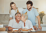 Birthday, family and senior parents with cake for party, celebration and festive event in home. Happy, smile and elderly mother, father and couple with dessert, decoration and celebrate for love