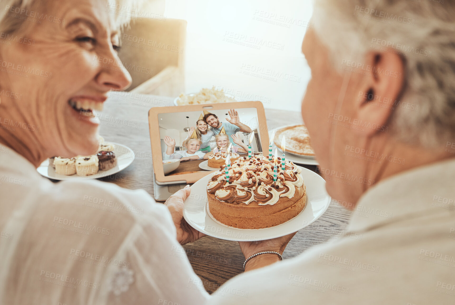 Senior, couple and happy birthday video call in home with cake, family and  happiness in celebration. Old people, smile and congratulations for festive  day in retirement with love, care and support |