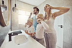 Smile, family and brushing teeth with girl children in the bathroom for learning about oral hygiene. Mother, father and sister kids together in their house for dental care education in the morning