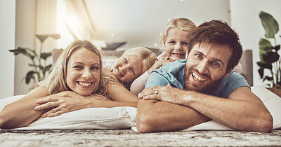 Buy stock photo Relax, happy family and parents with children on living room floor laughing together in the morning with happiness. Love, care and mother bonding with father and kids with memory, trust and smile