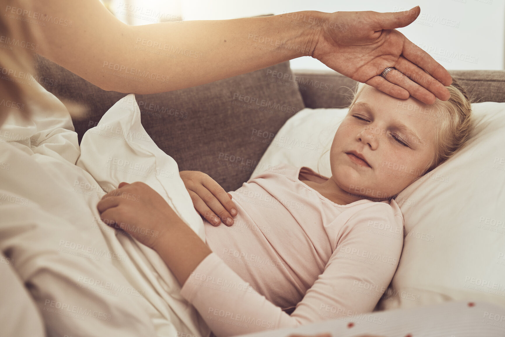 Buy stock photo Fever, mom and sick child on sofa with temperature check, stress and health care treatment in home. Healthcare, mother and sleeping daughter on couch, hand on forehead in comfort or medical emergency