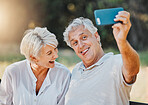 Senior couple, tongue and selfie in outdoor nature garden for love memory, connection and retirement emoji. Elderly man, funny face and laughing woman for social media photography and profile picture