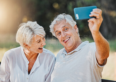 Buy stock photo Senior couple, tongue and selfie in outdoor nature garden for love memory, connection and retirement emoji. Elderly man, funny face and laughing woman for social media photography and profile picture