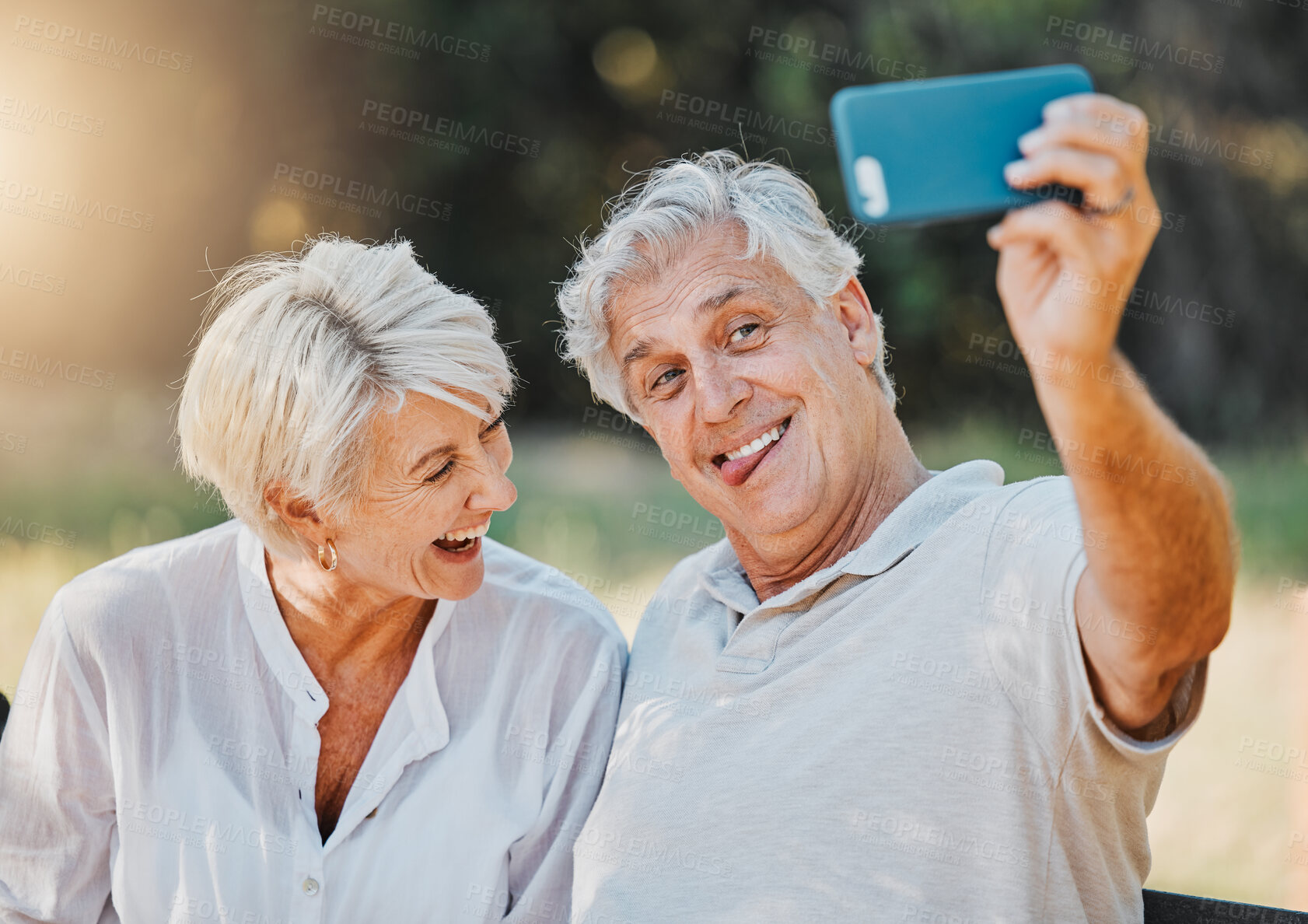 Buy stock photo Senior couple, tongue and selfie in outdoor nature garden for love memory, connection and retirement emoji. Elderly man, funny face and laughing woman for social media photography and profile picture