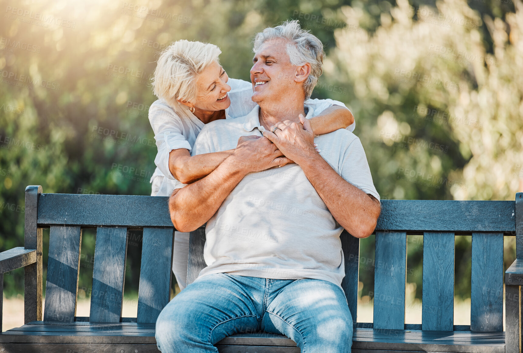 Buy stock photo Happy couple, senior and hug on park bench for love, support and bonding together in retirement and nature garden. Smile, relax and elderly woman embrace man in Australia backyard for marriage trust