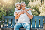 Senior happy couple, portrait or hug on park bench for love, support or bonding retirement trust in nature garden. Smile, relax or elderly woman embrace man in Australia backyard for marriage loyalty