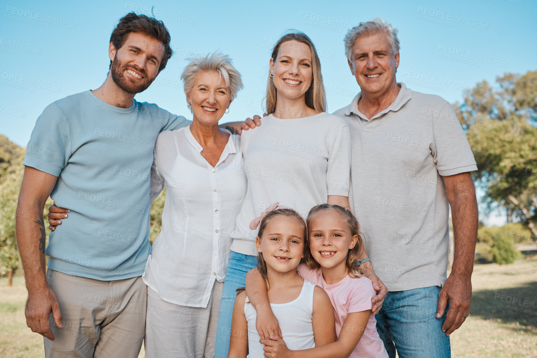 Buy stock photo Nature portrait, hug and happy family children, parents and senior grandparents enjoy reunion with mom, dad and kids. Park, love and relax people bonding, care and embrace young sisters in Australia