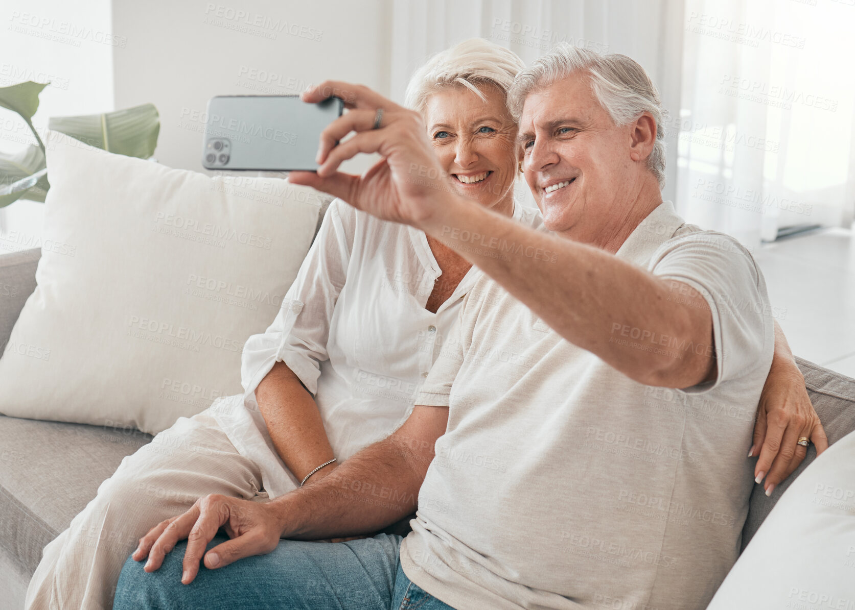 Buy stock photo Happy, selfie and old couple on sofa in home, living room or apartment in retirement with post on social media. Mature, people and smile in profile picture, live stream or video call with smartphone