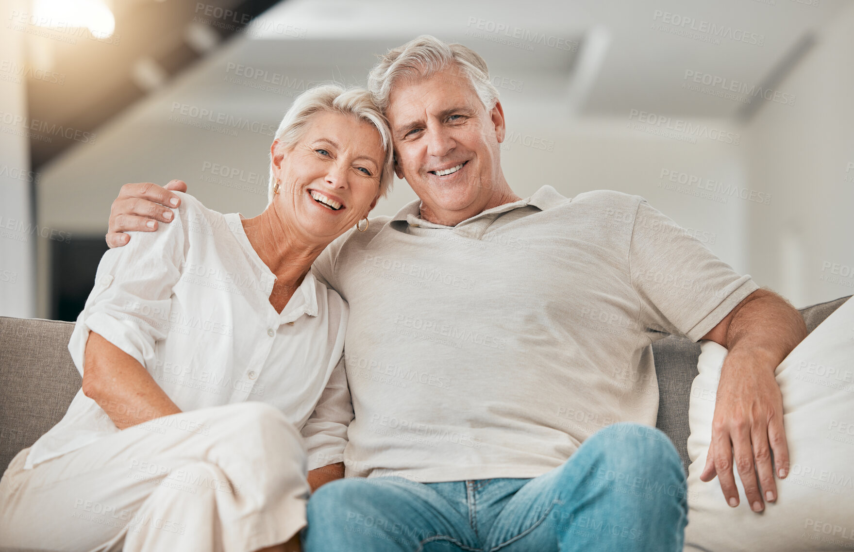 Buy stock photo Happy senior couple, portrait and hug on living room sofa in relax, embrace or love for support at home. Mature man and woman smile in retirement, trust or affection on lounge couch for care at house