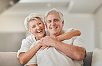 Happy senior couple, portrait and hug on living room sofa for embrace, relationship or love at home. Mature woman hugging man with smile in happiness for care, support or trust together in house