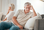 Ignore, senior couple and divorce on sofa in home living room for conflict, fight or stress for marriage crisis. Elderly man, woman and depression, angry at mistake or frustrated at relationship fail