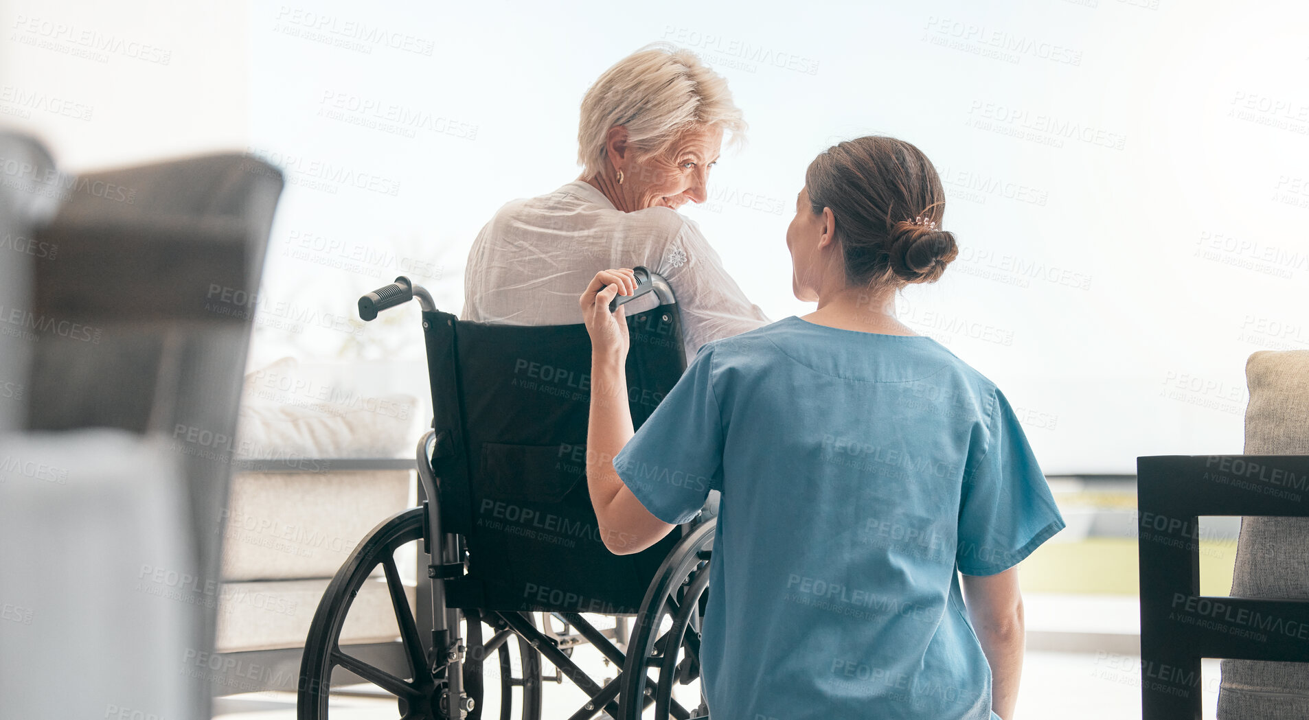 Buy stock photo Old woman in wheelchair, care or caregiver talking for healthcare support at nursing home. Back, view or happy nurse speaking to senior patient or elderly person with a disability for empathy or hope