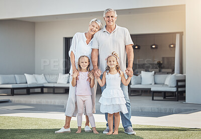 Buy stock photo Smile, portrait and grandparents with girl children in the backyard of family home in Australia. Happy, love and kids bonding and having fun with grandmother and grandfather in garden at modern house