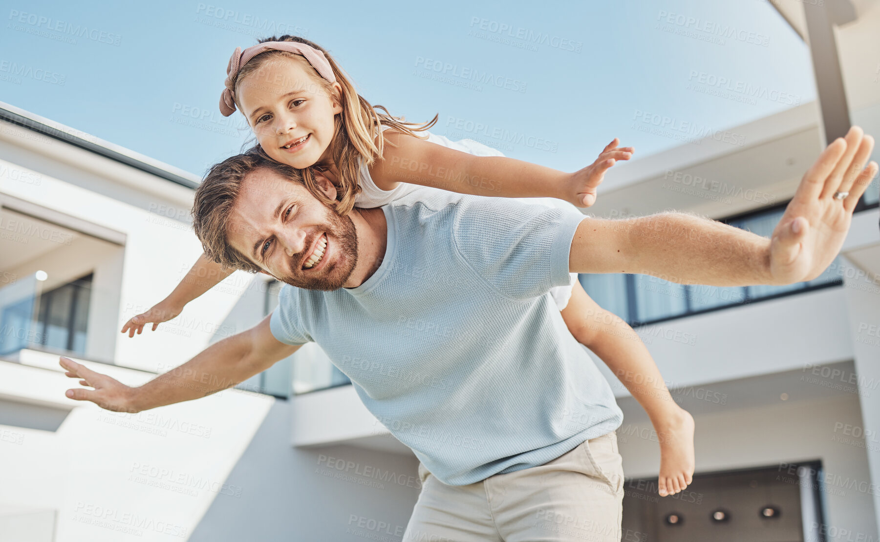 Buy stock photo Portrait, girl and flying on back of her dad in a backyard of a home for real estate or property ownership. Love, children or family with a father and daughter in celebration of financial freedom