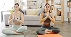 Yoga, friends and women with meditation, balance and workout in living room, calm and peace. People, females and girls in lounge, exercise and pilates training for wellness, chakra and zen for health