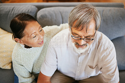 Buy stock photo Conversation, happy and senior couple on a sofa bonding, talking and relaxing together in living room. Smile, love and top view of elderly man and woman in retirement speaking in lounge at home.