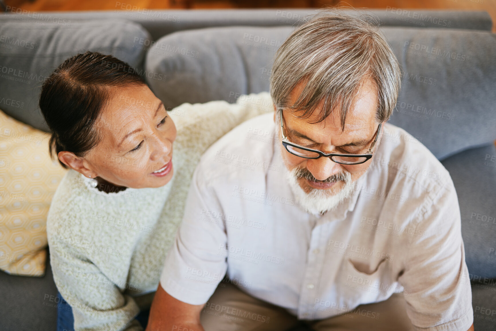 Buy stock photo Conversation, happy and senior couple on a sofa bonding, talking and relaxing together in living room. Smile, love and top view of elderly man and woman in retirement speaking in lounge at home.