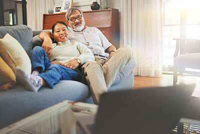 Buy stock photo Senior couple watching a movie on sofa with laptop in the living room together for bonding. Happy, smile and elderly man and woman in retirement relaxing and streaming show or film in lounge at home.