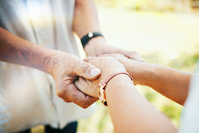 Buy stock photo Holding hands, closeup and couple in park, sunshine and care with bonding, faith or pray in nature. People, trust and support for empathy, romance or comfort in backyard, lawn or outdoor for kindness