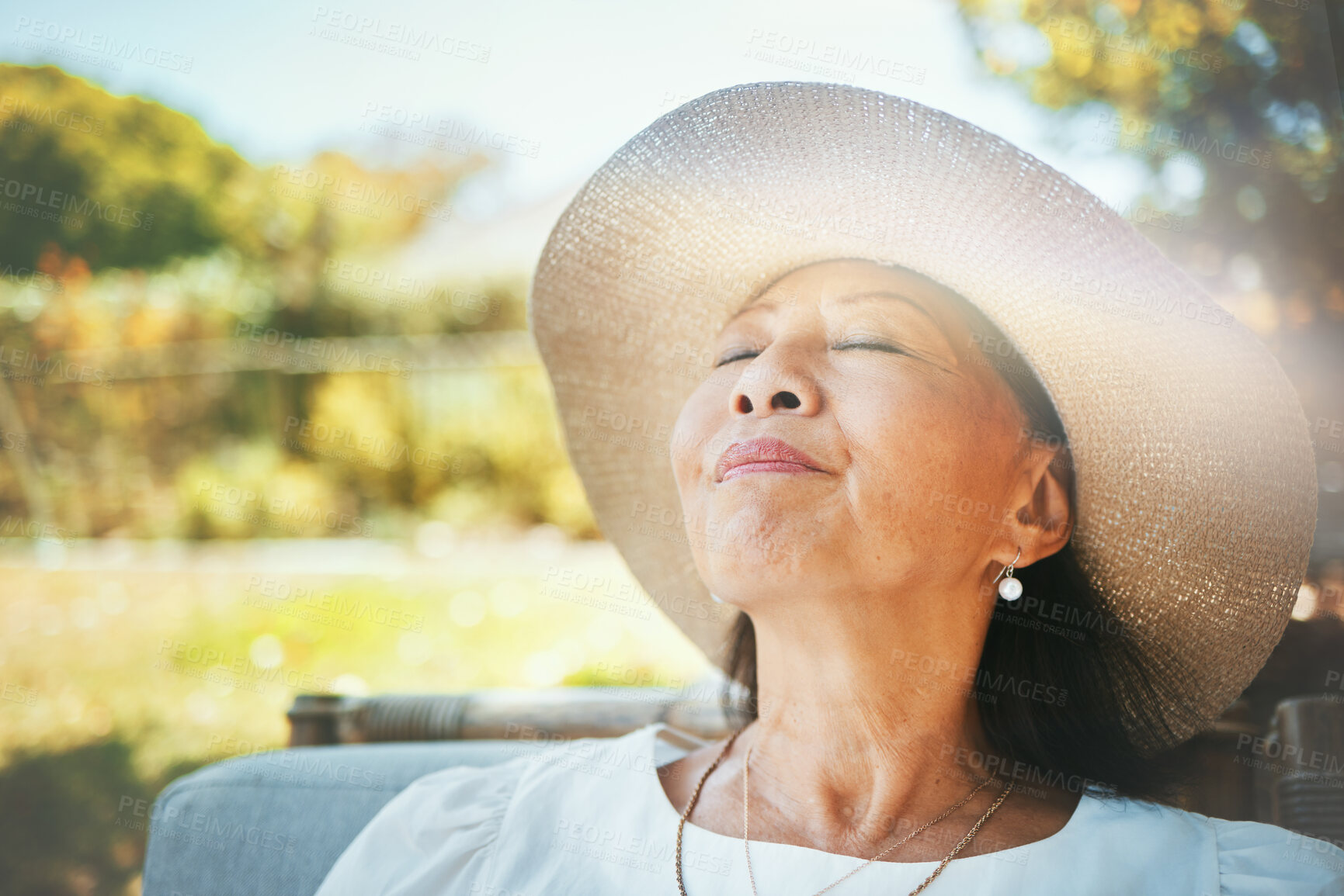 Buy stock photo Face, relax and a senior woman in the garden of her home during summer to enjoy retirement. Nature, peace and quiet with an elderly person in the backyard for freedom or wellness in the countryside