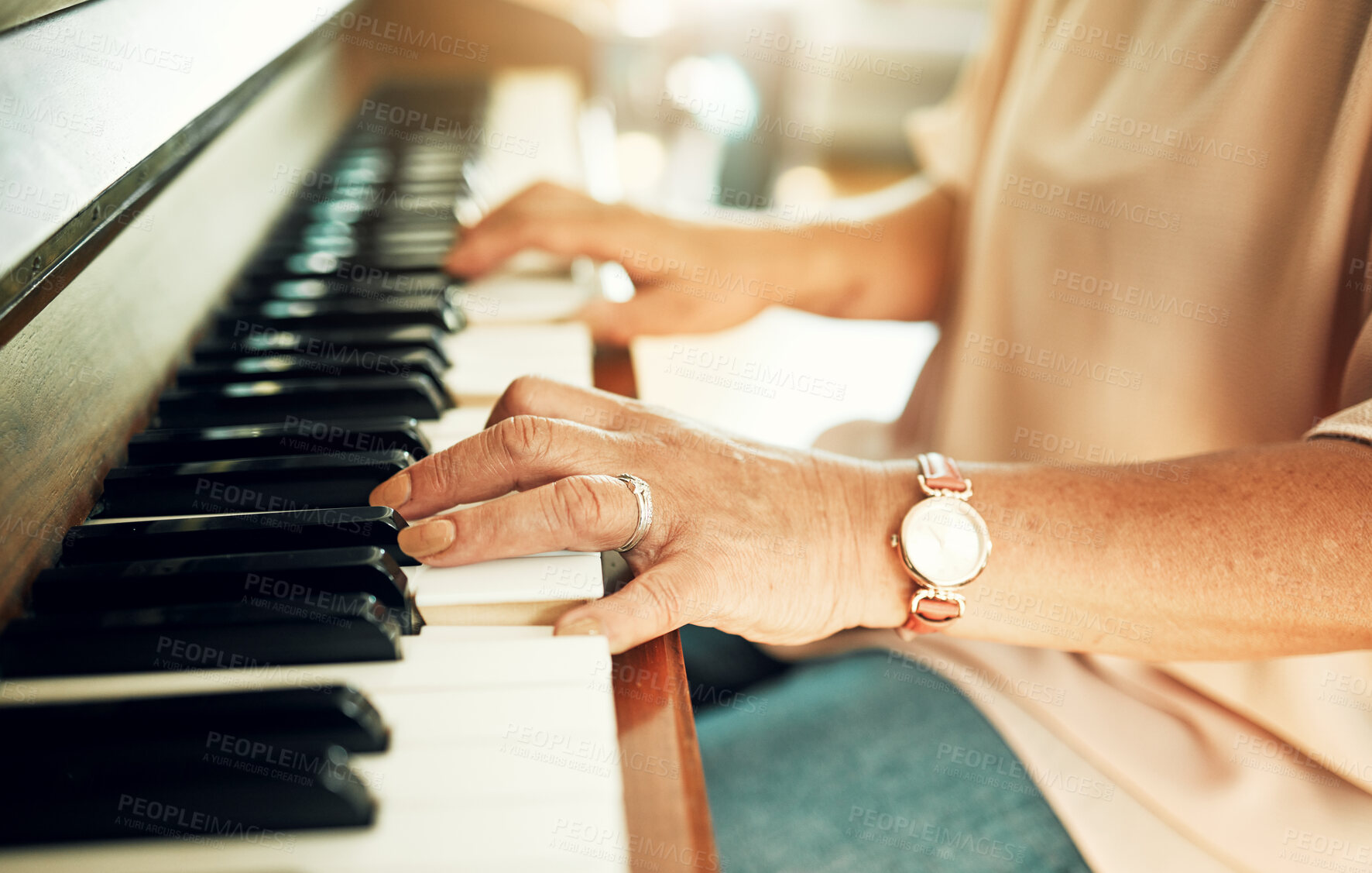 Buy stock photo Hands, closeup and woman playing piano for music in living room for musical talent practice. Instrument, song and zoom of senior female person in retirement enjoying keyboard at modern home.