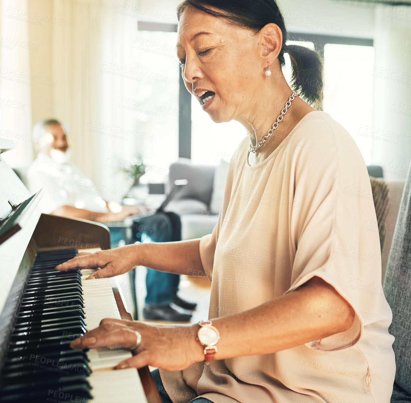 Buy stock photo Singing, piano and senior woman playing for music with husband in living room for bonding and entertainment. Instrument, practice and elderly Asian man and woman in retirement with keyboard at home.