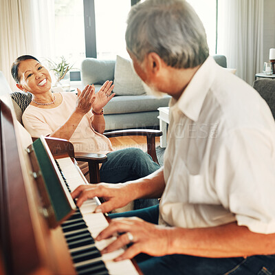 Buy stock photo Smile, piano and senior man playing a song to his wife for music in living room with bonding or entertainment. Happy, instrument and elderly Asian couple in retirement enjoy keyboard at modern home.