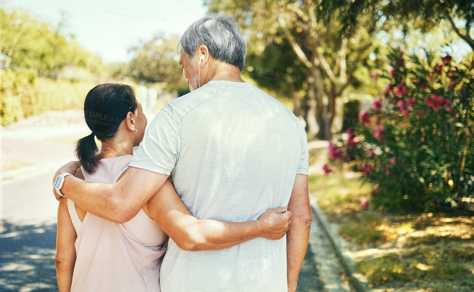 Buy stock photo Back, hug and a senior couple on a walk for bonding, love and exercise in the morning. Happy, relax and an elderly man and woman in the street together for romance in retirement or a marriage