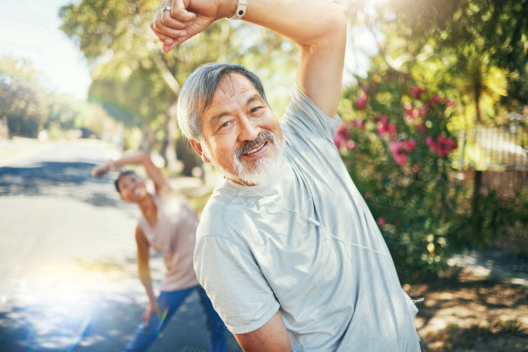 Buy stock photo Man, smile and stretching arms for run outside, earphones and listening to music, audio and song for motivation. Healthy couple, cardio and training in retirement, workout and exercise for fitness