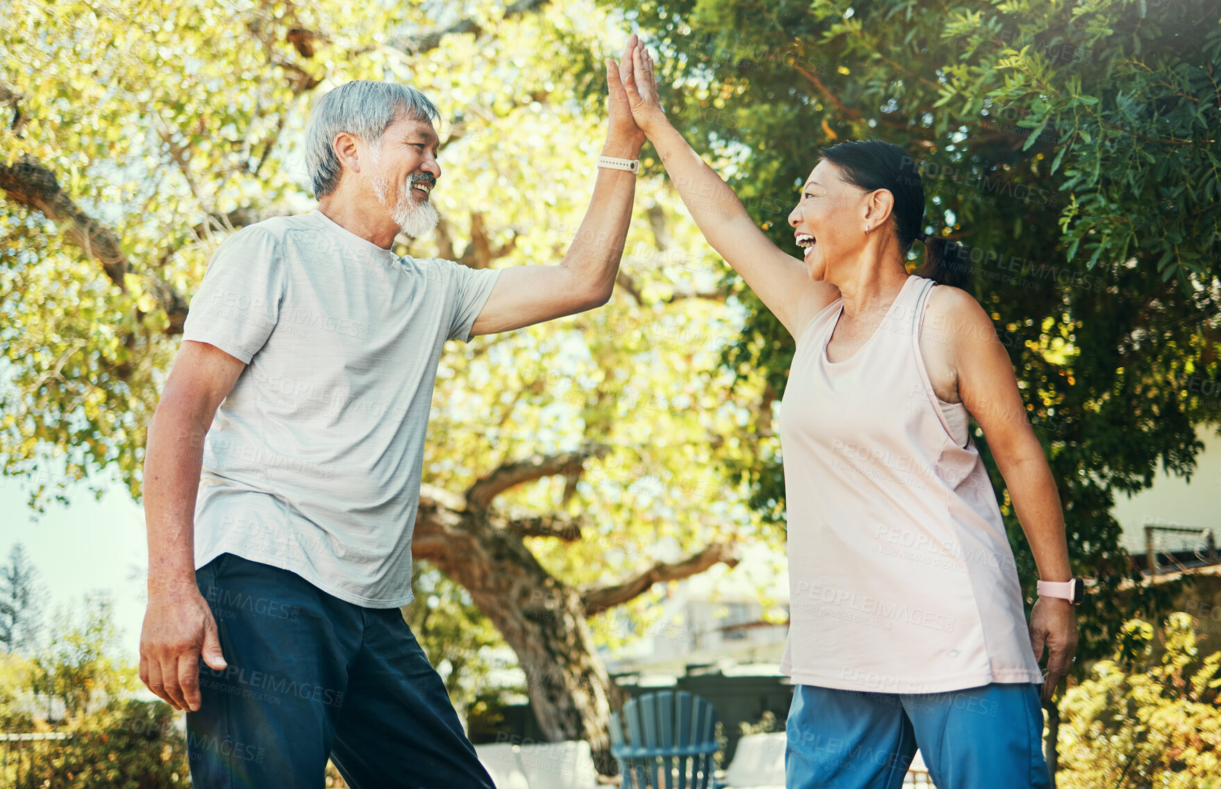 Buy stock photo Asian couple, elderly and high five in park for fitness, exercise and workout in summer with smile. Senior, man or woman or holding hands outdoor in nature or backyard for bonding, love and care