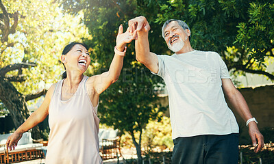 Buy stock photo Asian couple, senior and dance in park with smile for date, peace and romance with sunlight. Elderly, man and woman or holding hands outdoor in nature or backyard for bonding, fun and love or care